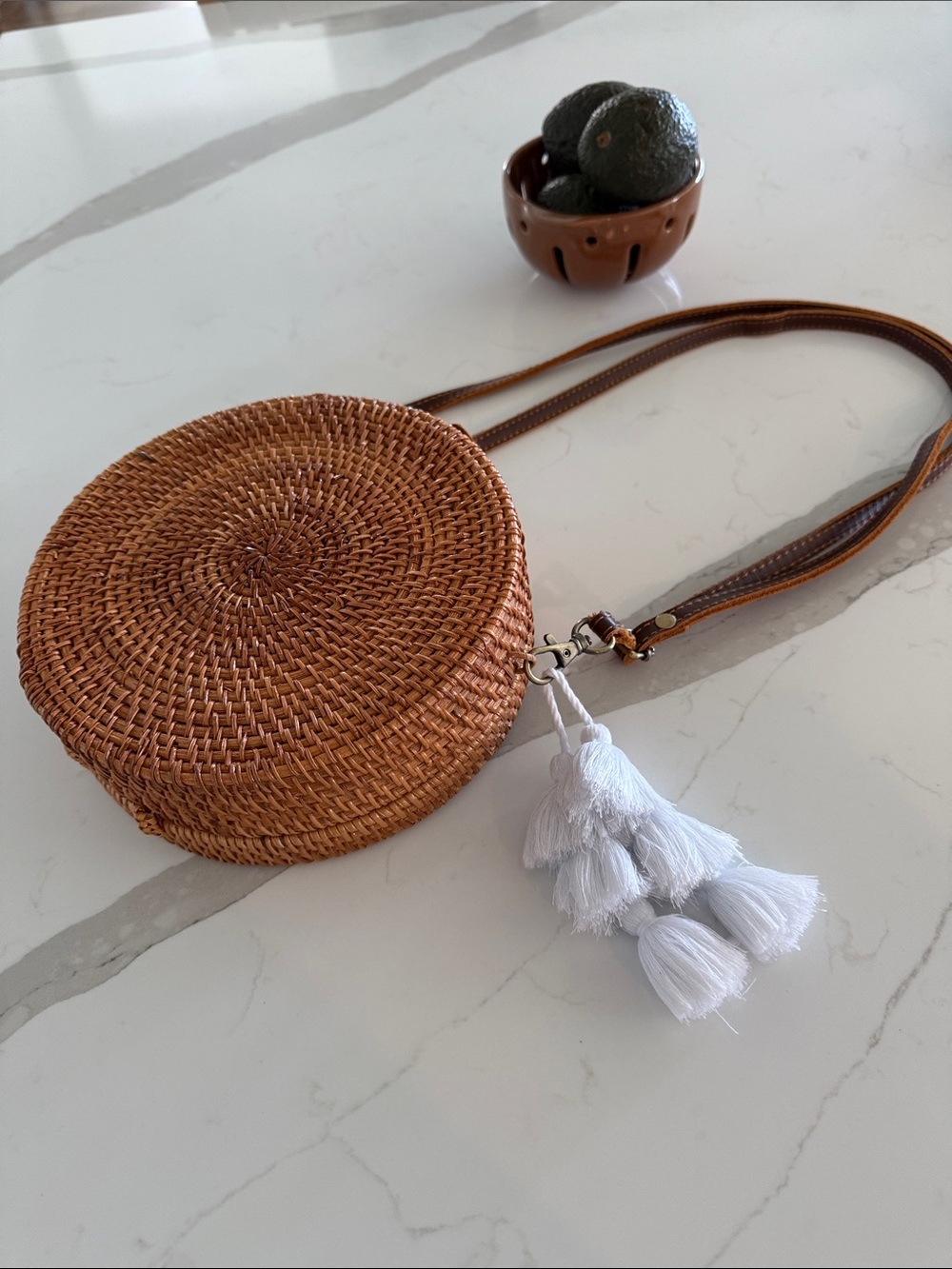Round Woven Crossbody Bag with White Tassel Accent